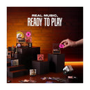 Mini Brands Really Works Vinyl Playset Series 1 by ZURU features a hand placing a pink record on a turntable, surrounded by miniature vinyl records and music-themed decor.