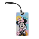 Minnie Mouse luggage tag featuring a smiling Minnie in a pink dress and bow, against a colorful polka dot background.