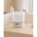 Momcozy 8-in-1 Baby Bottle Steam Sterilizer on a kitchen countertop, featuring a digital display and a transparent container.
