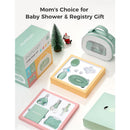 Momcozy All-in-1 Core Baby Kit displayed with a green carrying case, assorted baby care tools, and festive decorations.