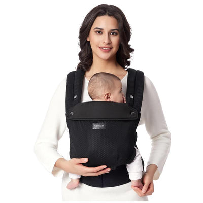 Momcozy black mesh baby carrier worn by a woman holding a baby, showcasing comfort and style for newborns to toddlers.