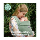 Momcozy baby carrier in sage green, holding a baby for close connection and bonding, with outdoor greenery in the background.