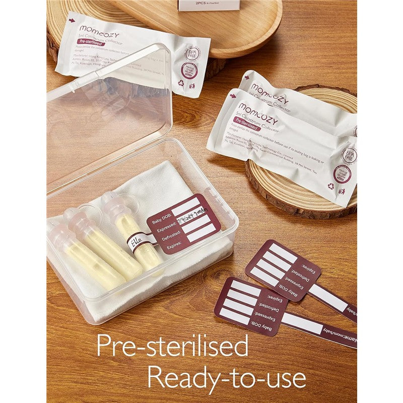 Momcozy Colostrum Reusable Breast Milk Collector in a clear box with two collector containers, labels, and pre-sterilized packaging.