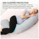 Pregnant woman resting peacefully with a gray J-shaped maternity body pillow, promoting side sleeping for better circulation.