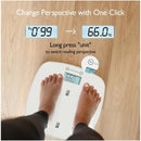 Multi-function baby scale showing a weight reading of 66.0 kg with feet on the scale and responsive digital display.