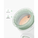 Portable Momcozy MW03 bottle warmer with a ceramic heating surface and a contact sensor feature indicated.