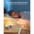 Momcozy Sunrise Alarm Clock with warm light, showing time display and icons for soothing sounds, next to a sleeping child.