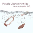 Momcozy green toothbrush with multiple cleaning methods, featuring a sterilizable design submerged in water.