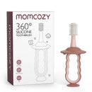Momcozy 360° silicone toothbrush in pink, featuring a soft bristle design and a unique handle for easy grip, suitable for ages 12+.