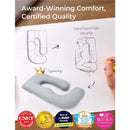 U-shaped grey pregnancy pillow with ergonomic design, sketched support for waist and hips, alongside award logos.