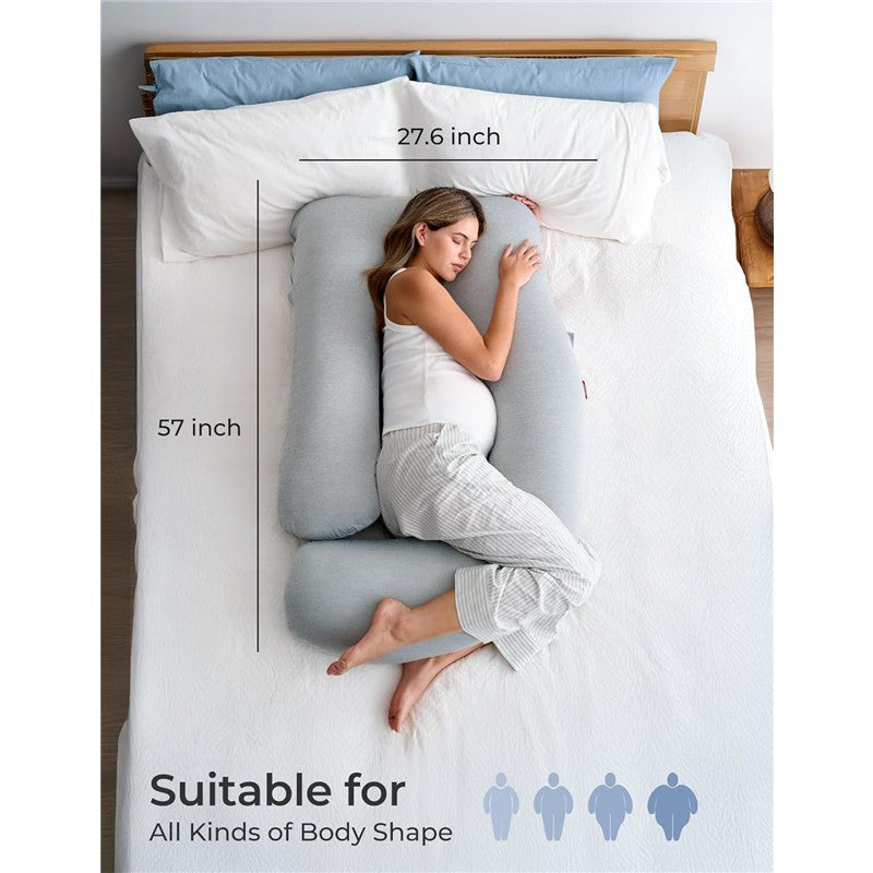 Pregnant woman sleeping on a U-shaped gray pregnancy pillow, showing dimensions and suitability for various body shapes.