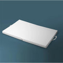 White, foldable mattress designed for Port A Crib, featuring a smooth surface and handles for easy transport.