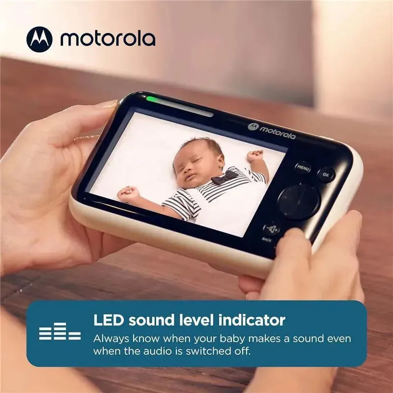 Motorola 5 Motorized Video Baby Monitor displays a sleeping baby, highlighting the LED sound level indicator feature.