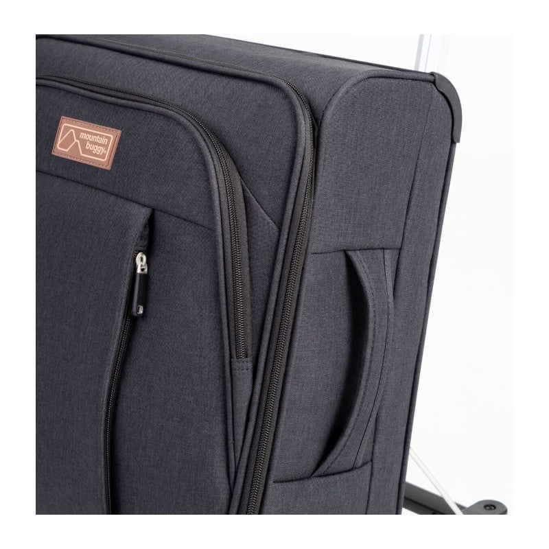 Luxury carry-on bag in dark fabric with zippers and handles, branded with Mountain Buggy logo.
