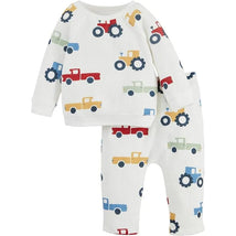 Two-piece baby boy outfit featuring a long-sleeve top and pants with colorful tractor and truck patterns.