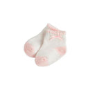Pink baby socks with a dot pattern and a small bow on the cuff, designed for baby girls.