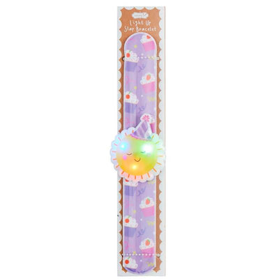 Light-up slap bracelet featuring a smiling sun design and colorful cupcake patterns on a purple background.