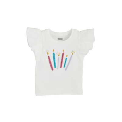 White birthday tee with ruffled sleeves featuring colorful candle designs and gold flame details.