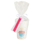 Birthday cup set featuring a cupcake design, colorful sprinkles, and pink candles, packaged in cellophane with a bow.