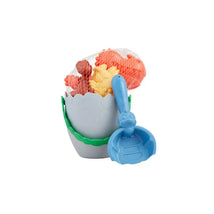 Grey dino egg beach set featuring a plastic egg, colorful dinosaur toys, and a blue scoop. Perfect for beach play.
