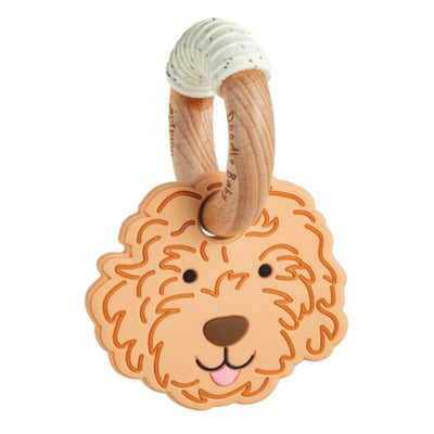 Light Golden Doodle-shaped teether with a wooden ring, designed for babies to chew and play with.