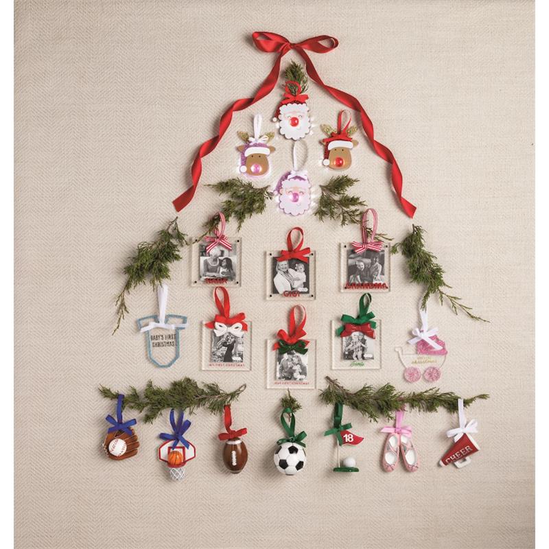 Red Bow Frame Ornament displayed as part of a Christmas tree arrangement with various seasonal ornaments and photo frames.