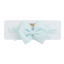 Light blue scallop bow headband by Mud Pie displayed on a white card, featuring soft fabric and a secure band.