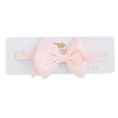 Light pink scalloped bow headband by Mud Pie, displayed on a white card.