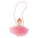 Red tulle ballerina purse designed as a doll, featuring a pink tutu, bow, and long strap for carrying.