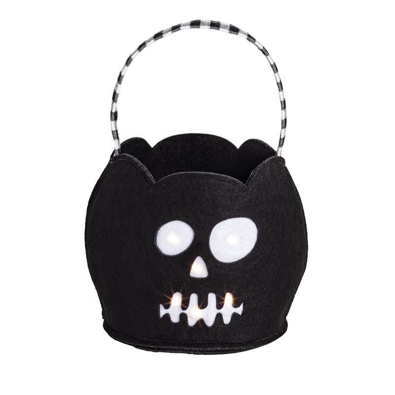 Black felt Halloween treat bucket shaped like a skull, featuring LED lights for illumination and a checkered handle.