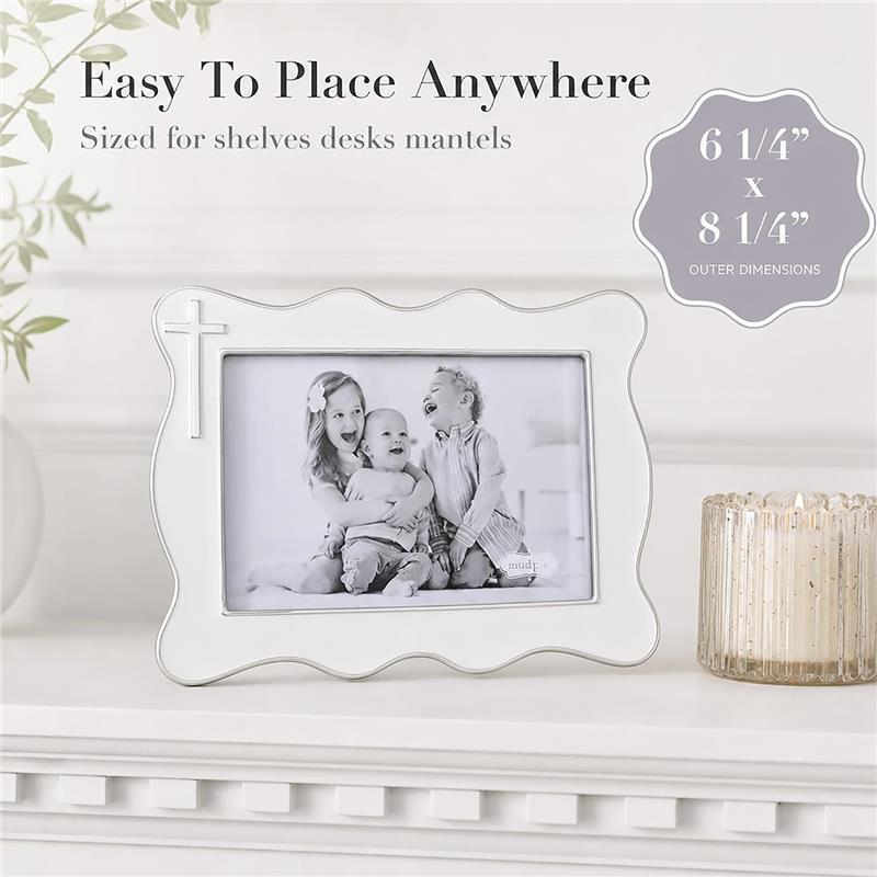 White enamel cross 4x6 picture frame with scalloped edges, displaying a black and white photo of three children.