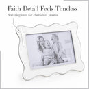 White enamel cross 4x6 picture frame featuring a scalloped design and a cross detail; holds a monochrome photo of three children.