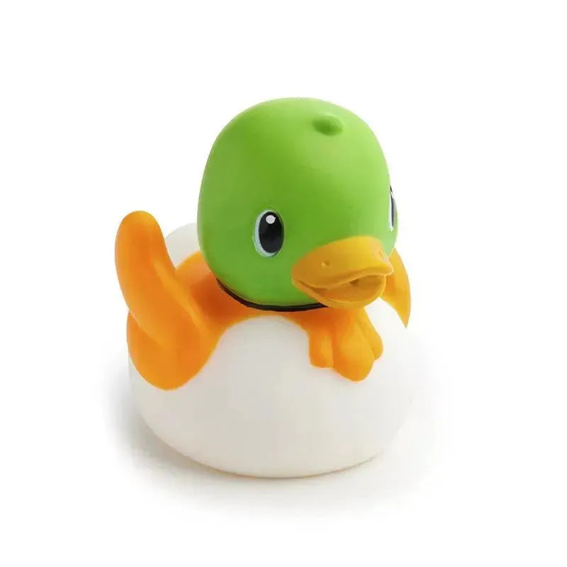 Colorful bath toy, a green duck with orange wings, floating on a white base. Part of the Munchkin Bath Lake Squirters, 8-Pack.