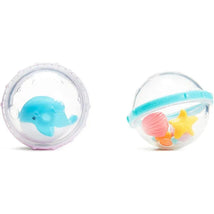 Two clear plastic spheres containing toys: a blue whale in one and colorful sea-themed shapes in the other.