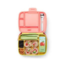 Bento box in yellow and pink with wrapped sandwiches, celery, blackberries, pretzels, and apple juice. Includes stainless steel utensils.