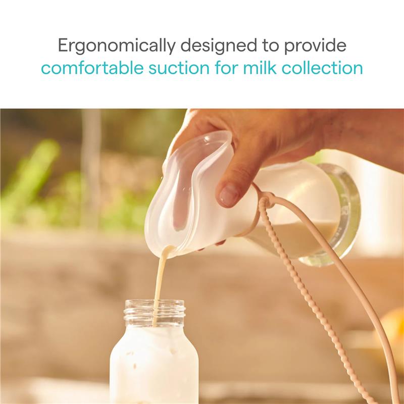 Munchkin Manual Breast Pump in clear and pink, shown actively collecting breastmilk into a bottle with ergonomic design.