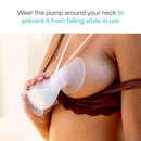 Munchkin Manual Breast Pump in clear and pink, held by a person, extracting breastmilk, with instructions to wear it around the neck.