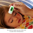 A child resting with a thermometer being taken on their forehead, displaying a digital reading of 98.6°F.