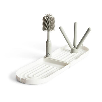 Munchkin Portable Drying Rack with a collapsible stand and a bottle brush for drying baby items.