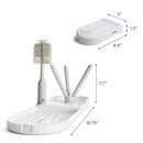 Munchkin Portable Drying Rack with adjustable holders and tray, designed for drying baby items and bottles.