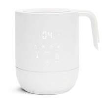 White Munchkin Precision Baby Bottle Warmer with digital display, designed for warming breastmilk.