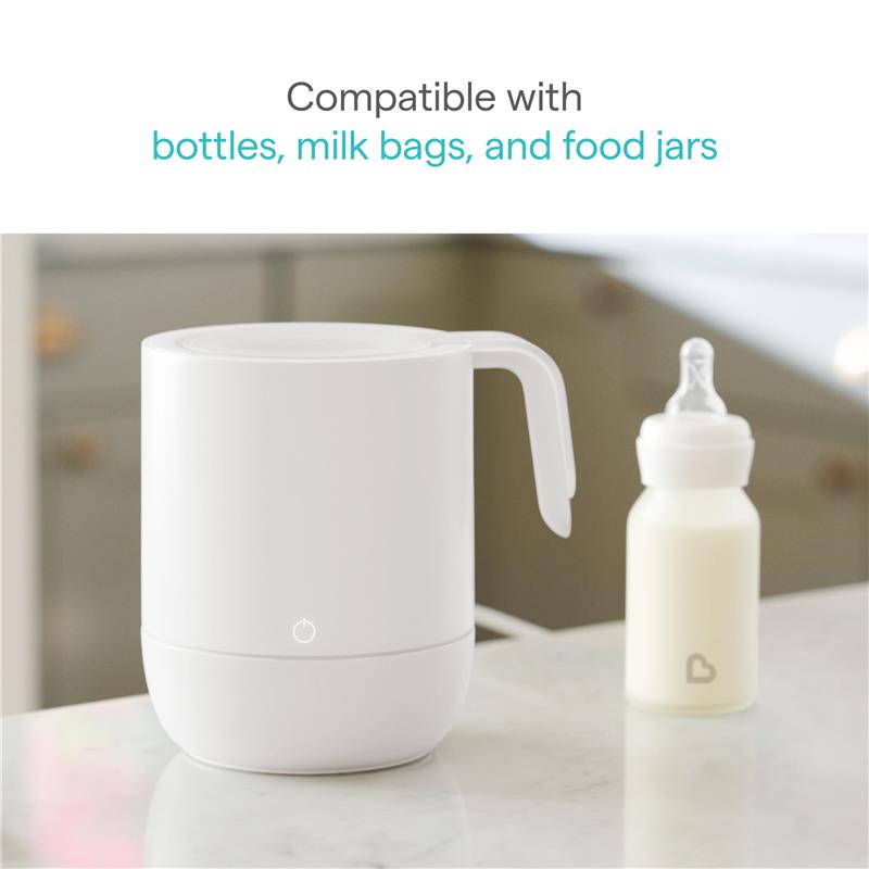 Munchkin Precision Baby Bottle Warmer in white, with a milk bottle beside it, indicating compatibility with bottles and bags.
