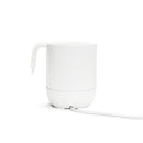 Munchkin Precision Baby Bottle Warmer in white, designed for warming breastmilk, with visible power cord.