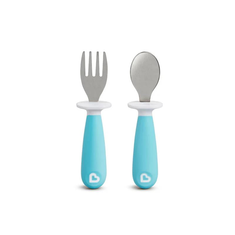 Toddler fork and spoon set with soft turquoise handles and stainless steel heads, designed for young children.