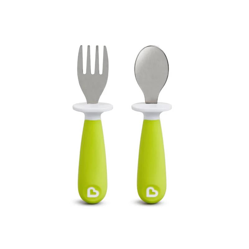 Toddler fork and spoon set with vibrant green ergonomic handles and stainless steel heads for easy use by young children.
