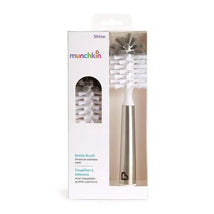 Munchkin Shine stainless steel bottle brush in packaging, featuring a premium design with white bristles and a silver handle.