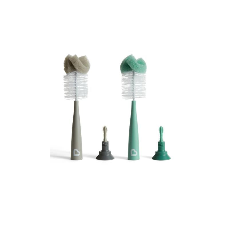 Two Munchkin sponge bottle brushes in gray and teal, with interchangeable cleaning bristles, on a white background.