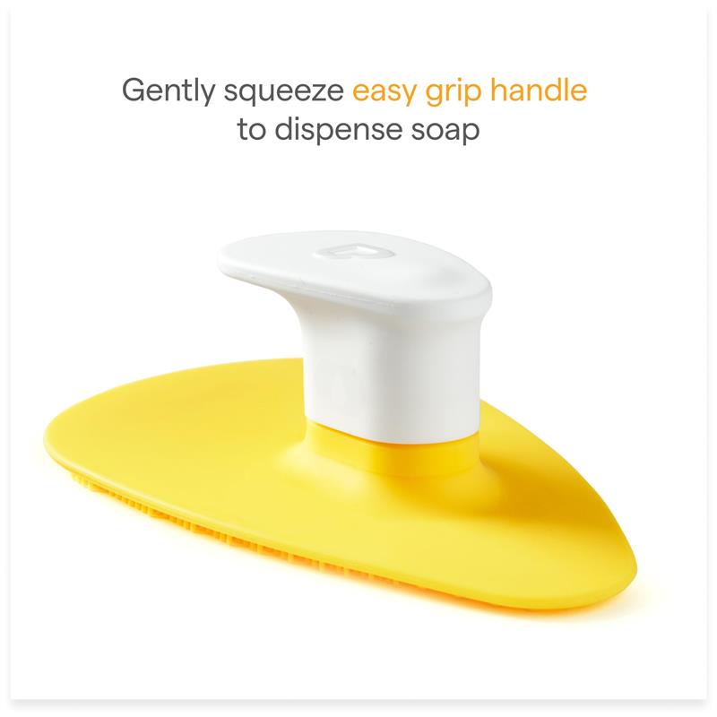 Silicone baby bath brush with yellow base and easy grip white handle for dispensing soap and shampoo.