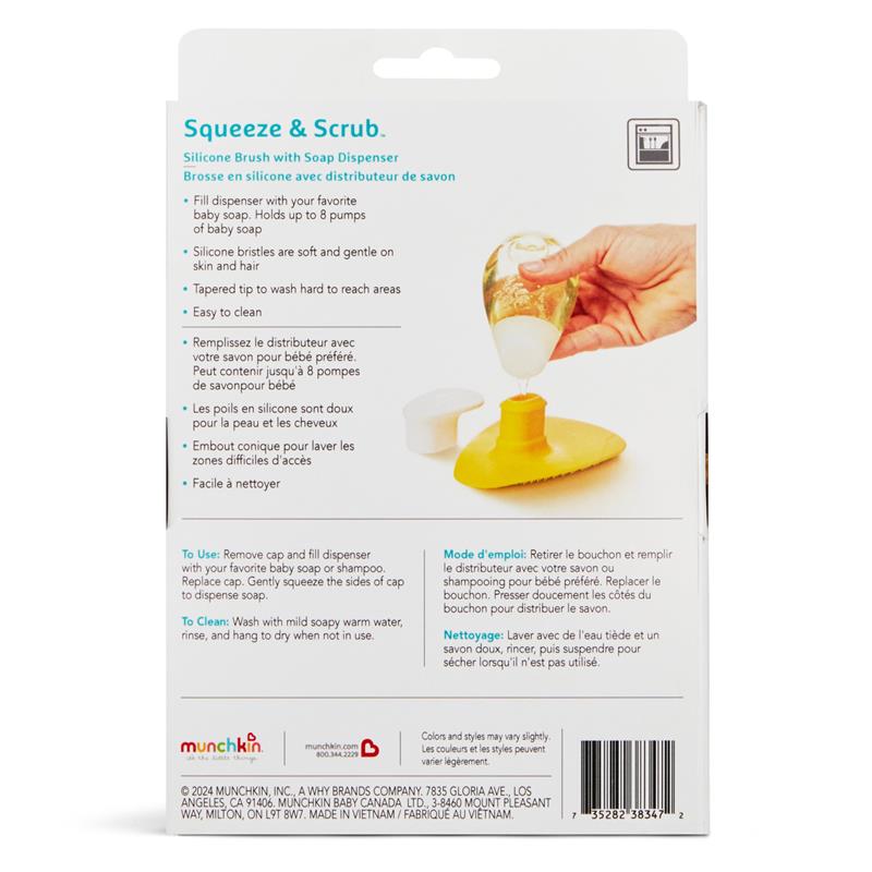 Silicone baby bath brush with an attached soap dispenser, showing a hand squeezing the cap to dispense soap.
