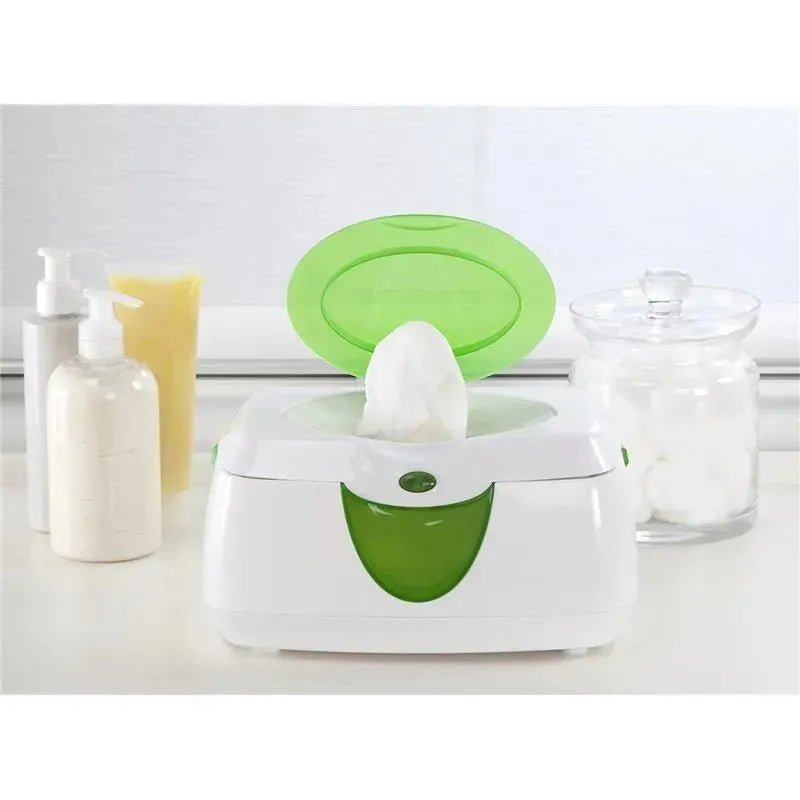 Munchkin Warm Glow Wipe Warmer, featuring a green lid and warm, moist wipes, surrounded by bottles and a jar of cotton balls.